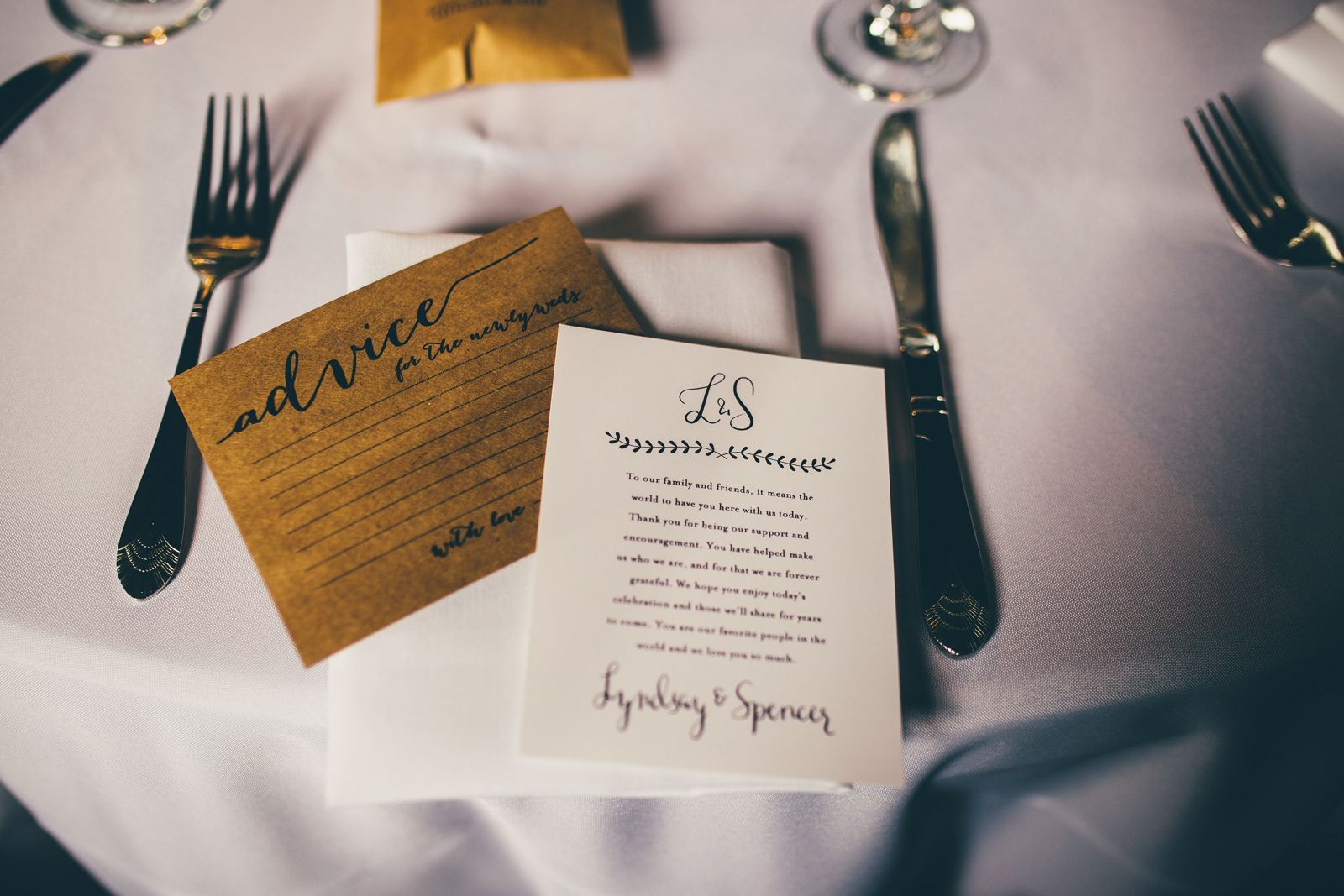 Wedding invitation suite on a linen table